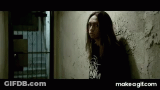 Long Haired Woman Leaning Wall Black Shirt NM GIF