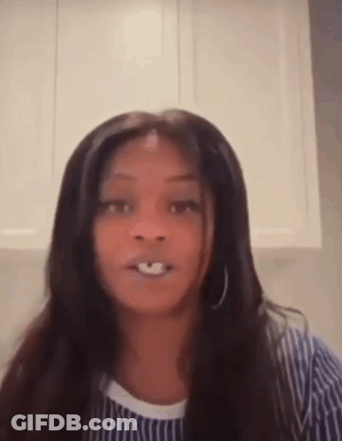 Long-Haired Woman Making Funny Face In Striped Shirt GIF