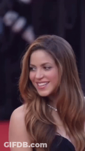 Long-Haired Woman Smiling On Red Carpet GIF