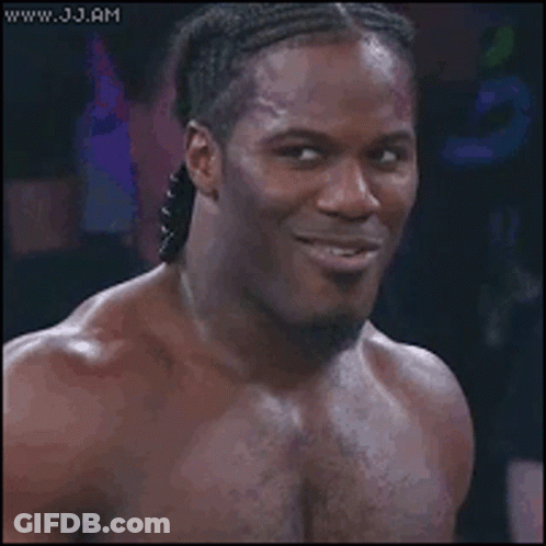 Long Haired Woman Smiling With Man Behind GIF