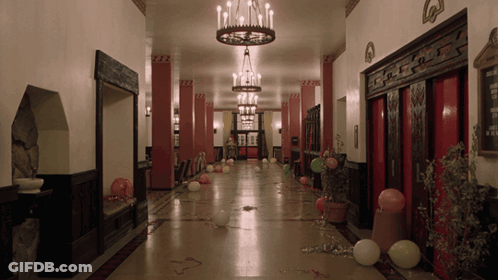Long Hallway With Balloons And Chandelier GIF