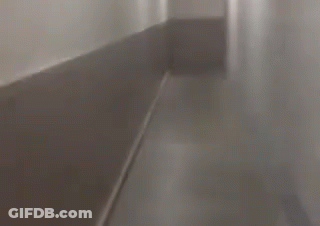 Long Hallway With Red Exit Sign GIF