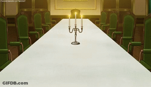 Long White Table With Candles And Reaching Hand GIF
