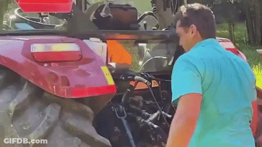Looking At Tractor's Engine GIF