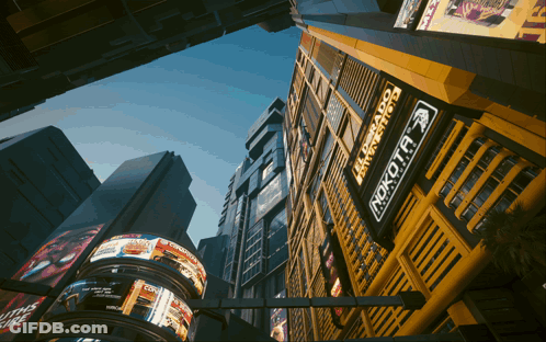 Looking Up At Building With Rokota Sign GIF