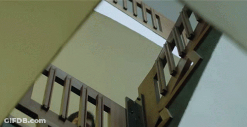 Looking Up At Wooden Staircase With Missing Steps GIF