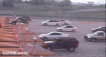 Lot Of Cars Driving Down Highway Including Jeep GIF