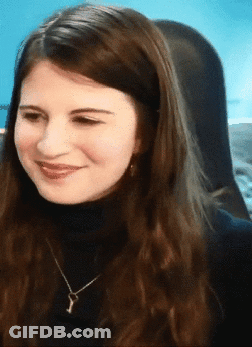 Lovely Lady In Black Gestures Heart Hands GIF