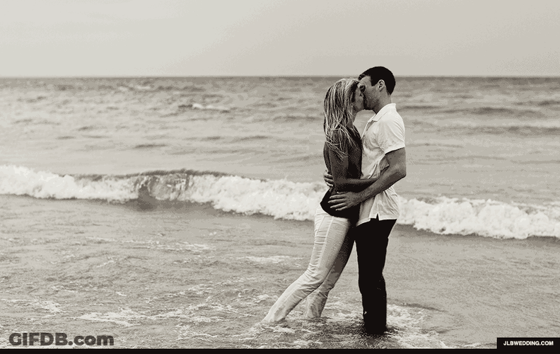 Lovers Passionate Kissing At The Beach GIF