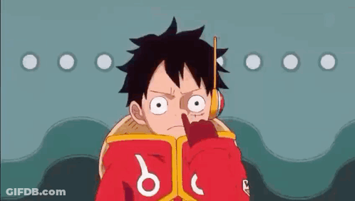 Luffy From One Piece Is Reading A Book While Holding A Stick In His Mouth . GIF