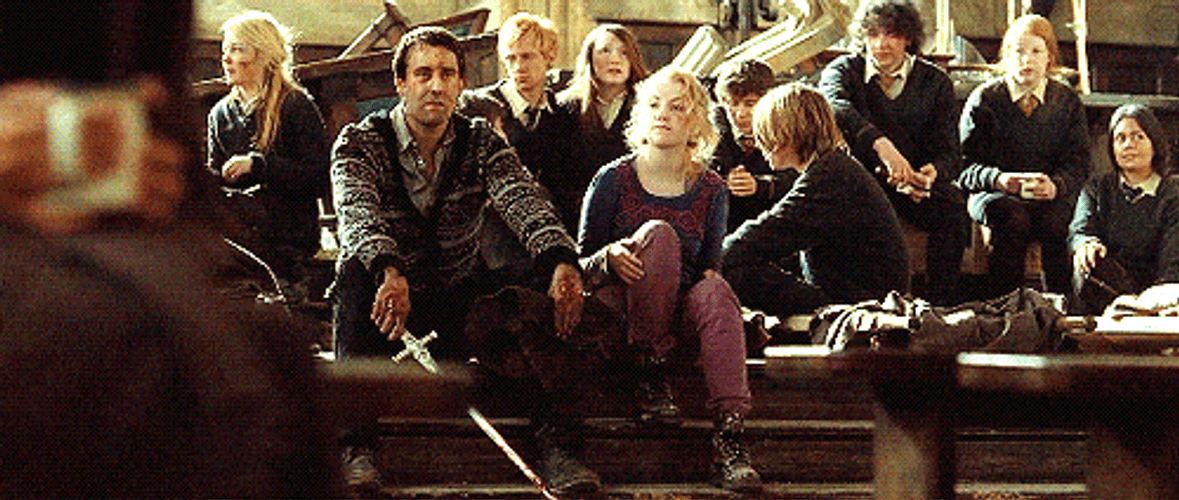 Luna Lovegood Sitting Beside Neville Longbottom GIF
