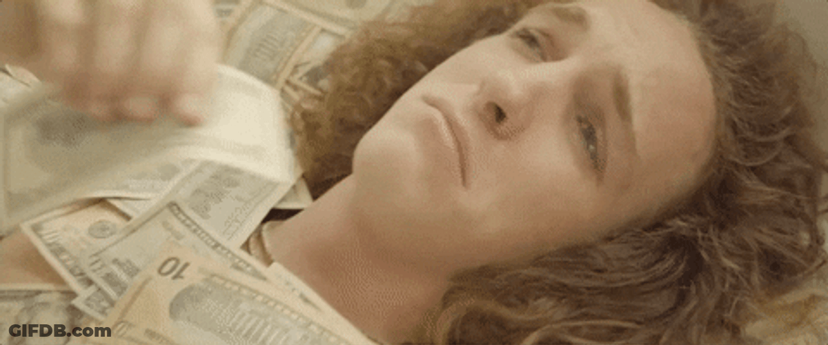 Lying On Money While Crying GIF