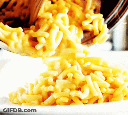 Macaroni And Cheese Being Poured Into A White Plate GIF