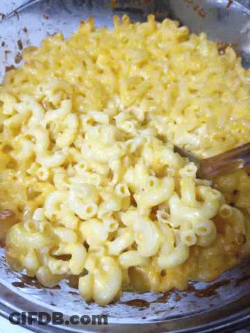 Macaroni And Cheese In A Bowl With A Fork In It GIF
