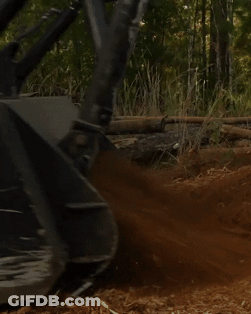 Machine Ejecting Mulch Slow Motion GIF
