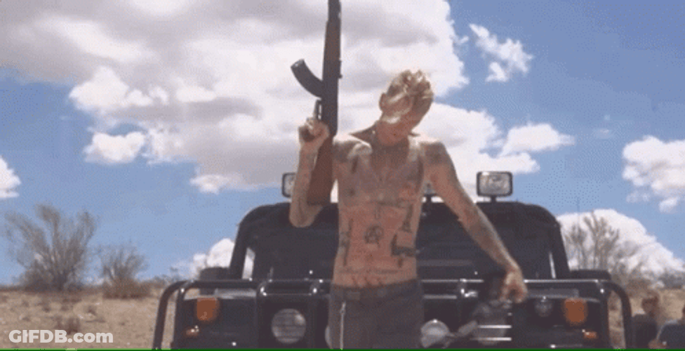 Machine Gun Topless Guy GIF