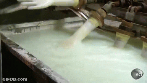 Machine Pouring Liquid Into Sci Container GIF