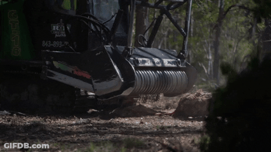 Machine Shredding Tree To Generate Mulch GIF