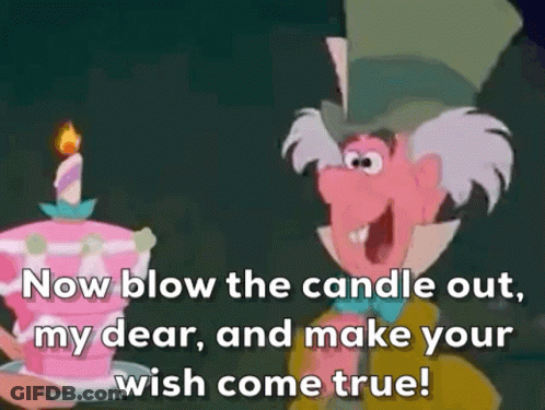 Mad Hatter Blowing Out Candle On Pink Cake GIF