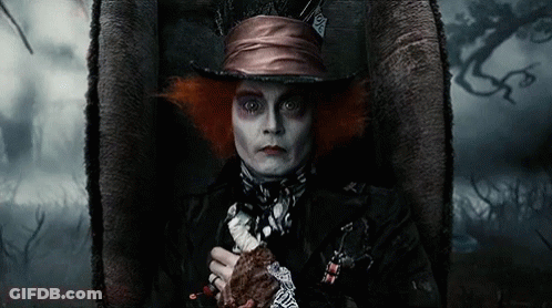 Mad Hatter Costume Man Sitting With Sword GIF