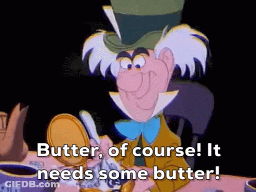 Mad Hatter From Alice In Wonderland Is Sitting At A Table With A Can Of Butter . GIF