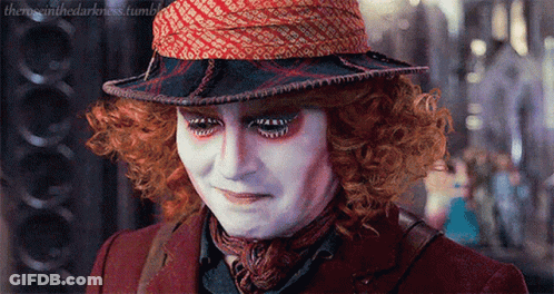 Mad Hatter From Alice In Wonderland Wearing Hat And Scarf GIF