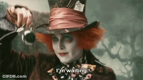 Mad Hatter Holding Watch Saying I'm Waiting GIF