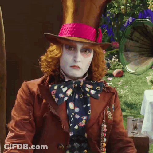 Mad Hatter In Brown Jacket And Pink Hat GIF