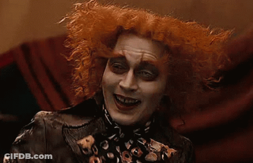 Mad Hatter Smiling In Leopard Print Jacket GIF