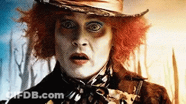 Mad Hatter Wearing Hat And Scarf GIF