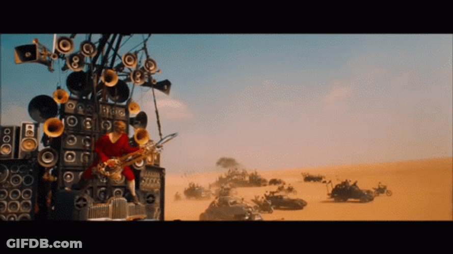 Mad Max Fury Road Doof Warrior Playing His Flame Throwing Guitar GIF