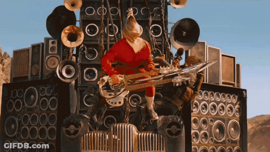 Mad Max Fury Road Doof Warrior's Guitar Used As Armor GIF