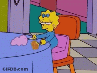 Maggie Simpson Is Sitting In A Pink Chair Next To A Table With Cotton Candy . GIF