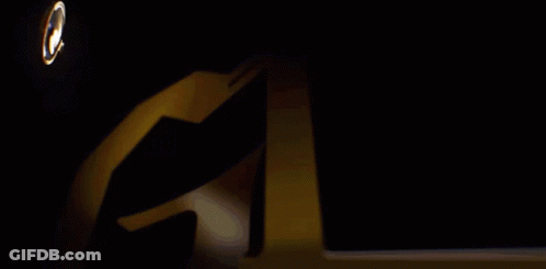 Magnifying Glass Looking At Gold Trophy GIF