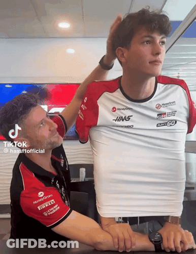 Man Adjusting Another Man's Shirt Saying HMS GIF