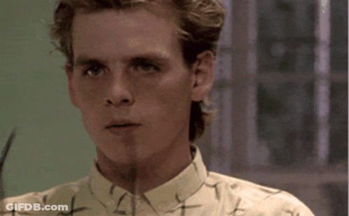 Man Adjusting Glasses With Word Nostalgia GIF