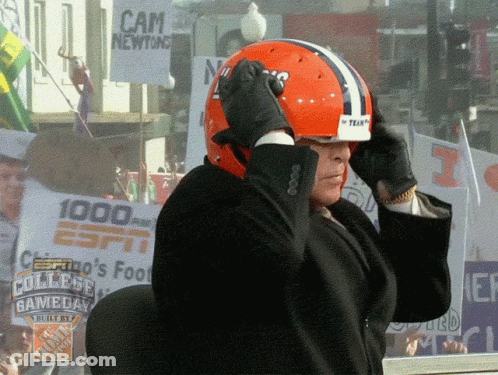 Man Adjusting Helmet In Front Of Cam Newton Sign GIF
