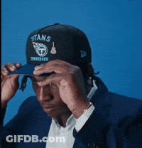 Man Adjusting Titans Hat GIF