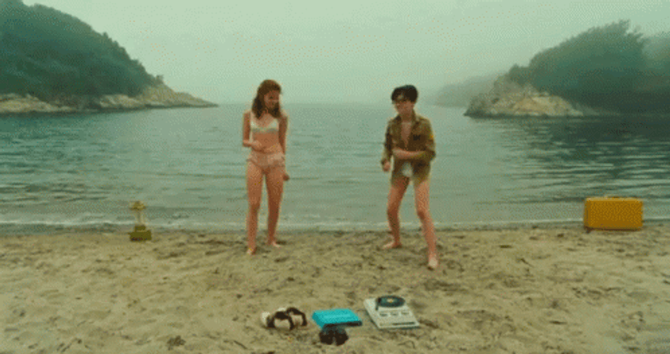 Man And A Woman In A Funny Beach GIF