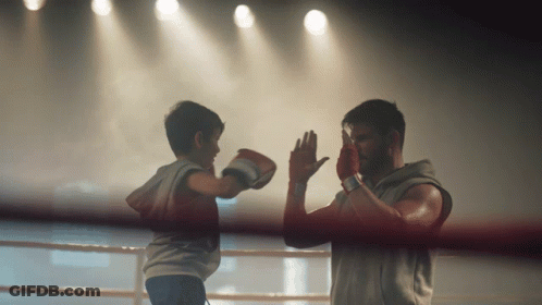 Man And Boy Boxing In Ring GIF