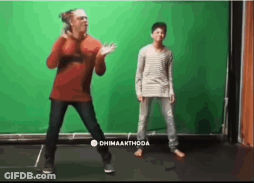 Man And Boy Dancing In Front Of Dhimaakthode Green Screen GIF