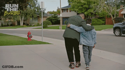 Man And Boy Hugging On Sidewalk Run The Burbs GIF