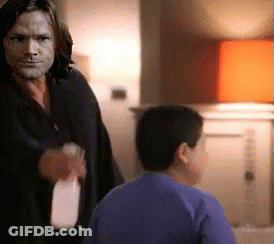 Man And Boy In Blue Shirt With Milk Bottle GIF