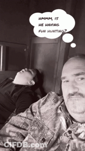 Man And Boy Laying Down With Thought Bubble Hmm Is He Having Fun Hunting GIF