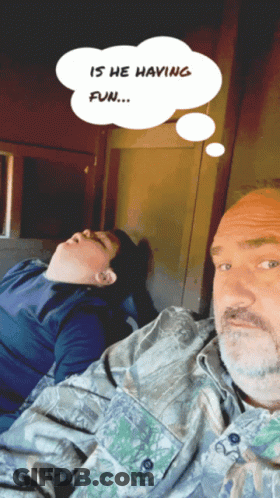 Man And Boy Laying Down With Thought Bubble Saying Is He Having Fun GIF