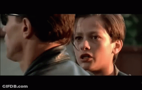 Man And Boy Looking At Each Other In Movie GIF