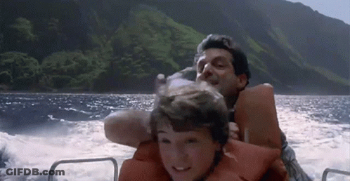 Man And Boy Riding Boat In Ocean GIF