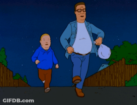 Man And Boy Running Down Street At Night GIF