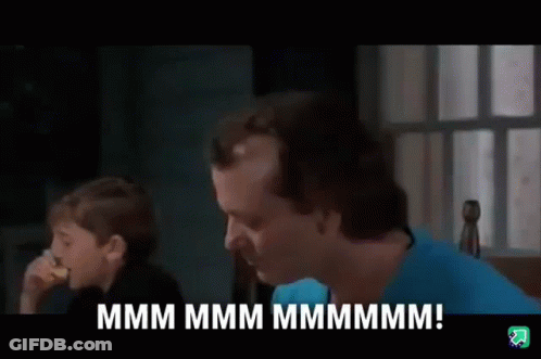 Man And Boy Sitting At Table Talking GIF
