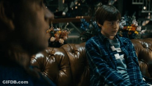 Man And Boy Sitting On Couch GIF